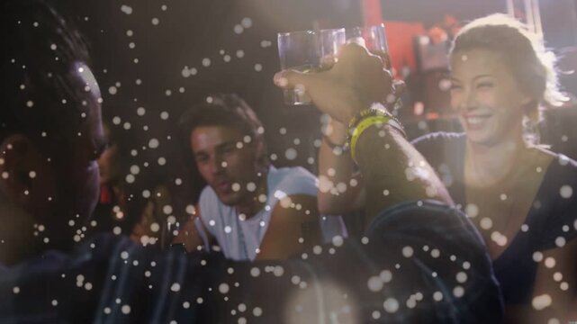 Man raising glass to woman at bar, initiating toast with beer mug clinking under bokeh-lens-flare