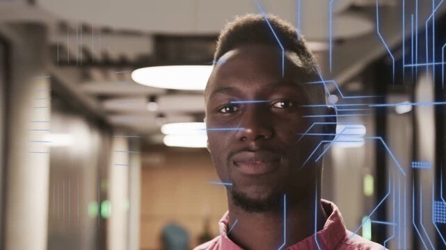 Tech data overlays appearing over face man in pink raising head, smiling, laughing then receding