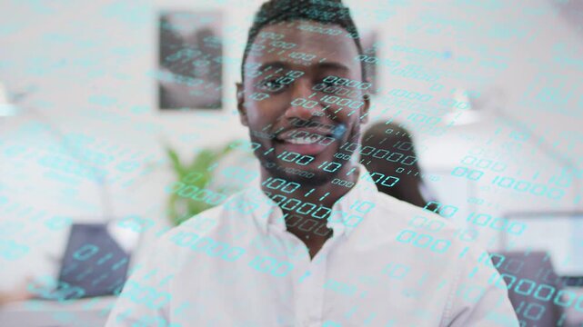 Male presenter smiling and presenting after upward reveal, binary tech overlay flowing across face