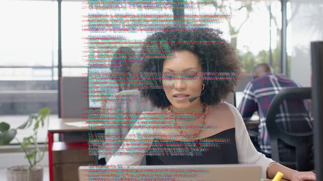 Support agent typing laptop on call, causing code static across screen then revealing content