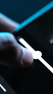 Hand pressing keyboard key in dark blue closeup