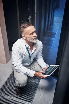 Tablet, man and technician with inspection, update or engineer on app in data center. Cybersecurity, database and mature programmer in server room with network maintenance or code for software