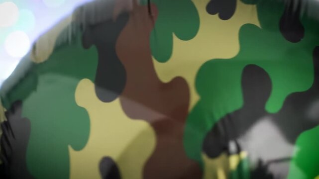 Abstract close-up of a glossy surface with a camouflage pattern