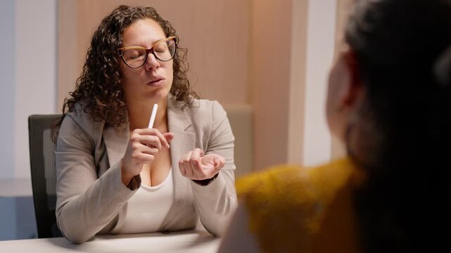 Confident businesswoman explaining strategy to colleague