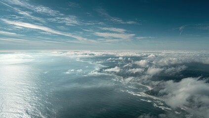 Obraz premium Aerial View of Ocean and Clouds from Above.