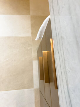 Close up of marble vanity with gold handles