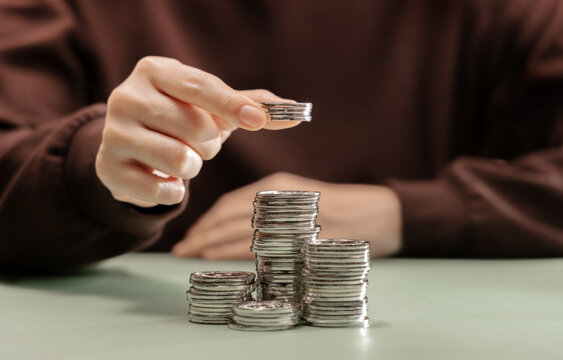 Growing stack of coins representing saving money, financial growth