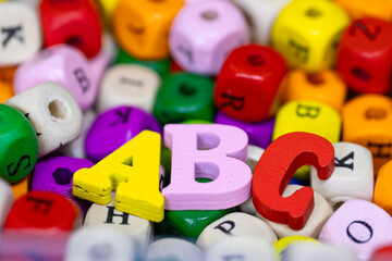 Fototapeta premium Colorful wooden ABC letters symbolizing early education learning
