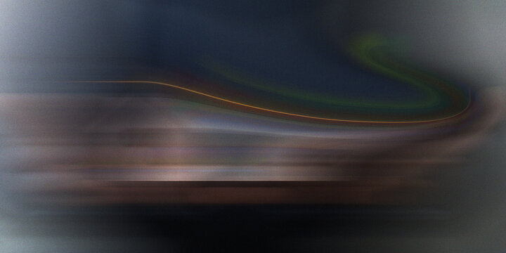 Motion blur abstract with dark blue and green wave light trails over blurred landscape horizon for futuristic speed concept.