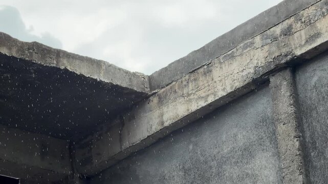 Heavy Rain Falling on Concrete Building Structure During Storm