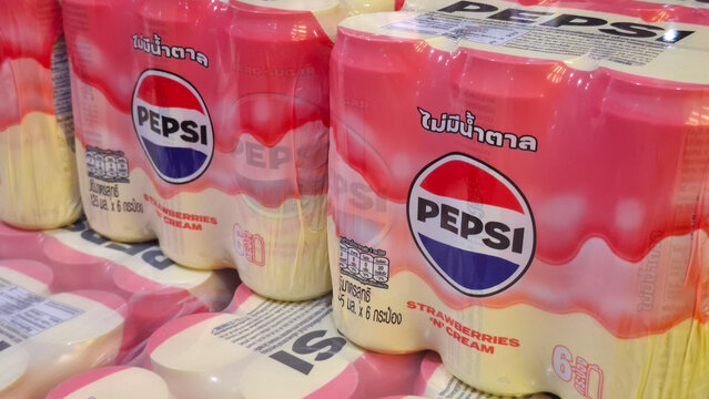 Packs of Pepsi zero sugar strawberries and cream flavor soda cans in plastic wrap packaging displayed on a retail store shelf on May 2, 2026 in Bangkok, Thailand