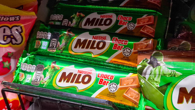 Nestle Milo Choco Bar chocolate malt wafer snacks in shiny foil packaging stacked on a retail supermarket shelf on May 2, 2026 in Bangkok, Thailand