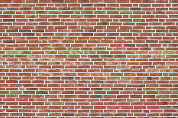 Naklejka premium Red brick wall with a textured surface featuring a variety of brick sizes and colors, creating a rustic and industrial appearance suitable for backgrounds and design projects