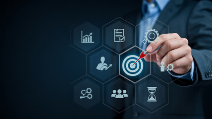 Obraz premium Business man touching a virtual screen with target dart icon and various business-related icons like growth, document, gear, and people, representing business planning and strategy.