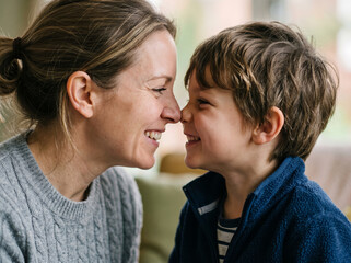 Obraz premium Mother and Son Touching Noses in a Tender Moment of Love