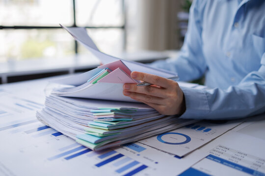 Business professional organizing documents managing data paperwork