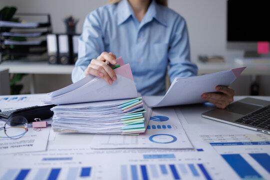 Professional accountant reviewing business documents and financial reports