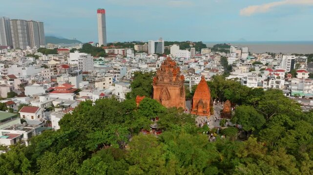 Po Nagar Cham Towers, Nha Trang, Vietnam. Tourists visit the ancient Cham temple complex, a historical and cultural landmark.