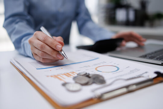 Woman analyzing financial data calculating budget and taxes