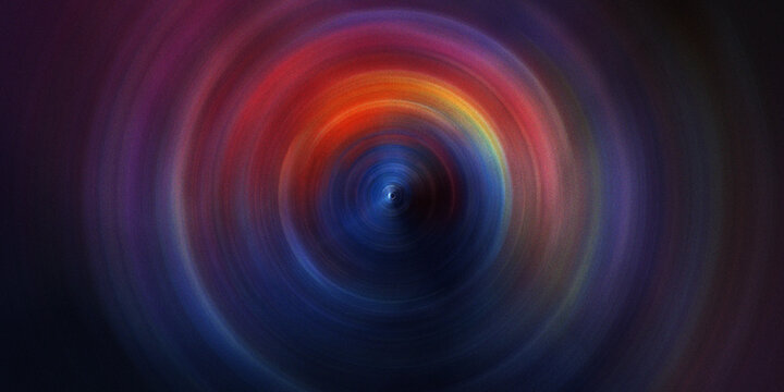 Stunning radial zoom effect with circular colorful light trails in blue red and orange swirling around dark central focal point.
