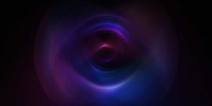 Swirling vortex of vibrant purple blue and pink light with dark background and motion blur.