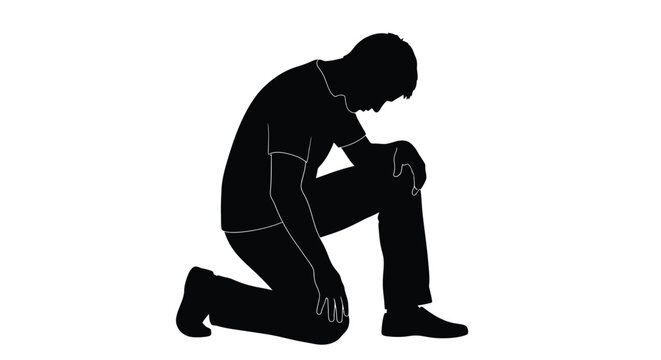 Silhouette of a man kneeling down with his head bowed in a contemplative pose alone