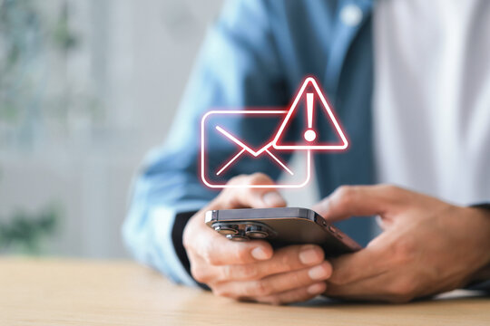 Email alert notification concept , businessman using a smartphone  Email warning notification and spam message.