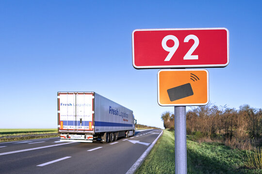 Pniewy, Poland - April 21, 2026. Polish road sign indicating mandatory electronic toll payment via the e-TOLL system for heavy vehicles like trucks, lorries and buses.