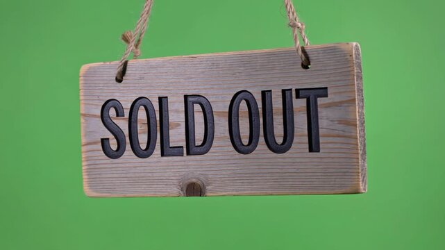 Wooden sign hanging with rope saying SOLD OUT, concept of no more availability
