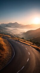 Winding Mountain Road at Sunrise with Misty Valleys © Adi