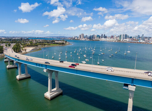 Aerial View Of Coronado Bridge And Golf Course With San Diego Skyline Background