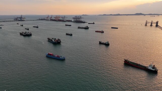 fast patrol boat with LPG gas and oil tanker ships anchored in the ocean, with a fast patrol boat in the foreground. Global energy transport, war energy crisis, and Strait of Hormuz blockade concept.	