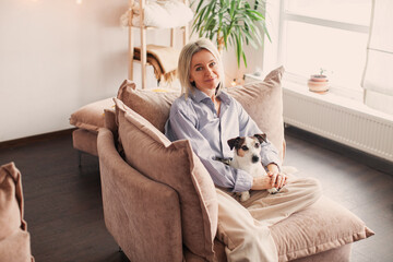 Cut Middle aged Woman sitting on couch at home