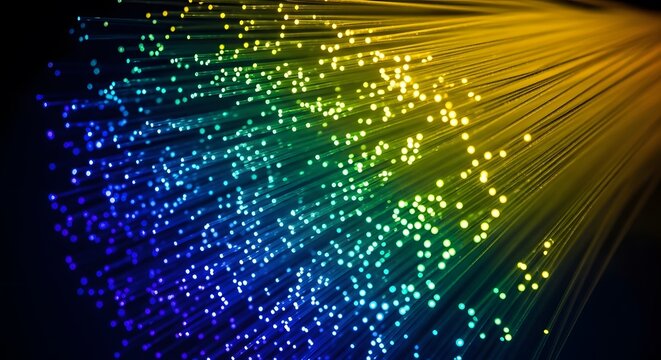 Close-up of glowing colorful fiber optic strands emitting light with optic cable