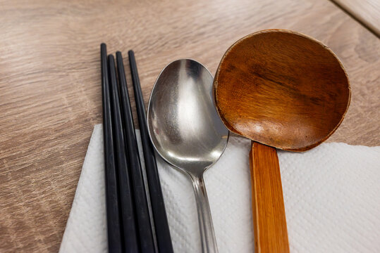 utensils for eating ramen (chopsticks, spoon, ladle) on a table in Japanese restaurant