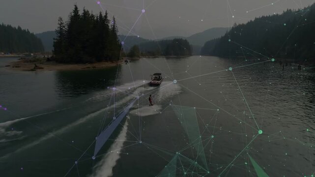 Boat moving in inlet, making twin wakes, rider carving turns for sport under faint overlay