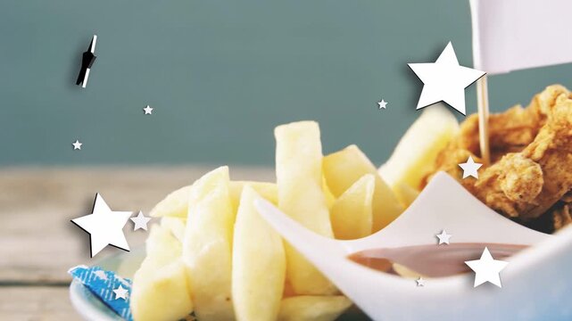 Camera pushing in, sliding right, revealing fries and chicken, stars drifting, highlighting plate