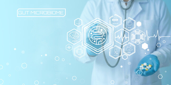 Medical professional examining gut microbiome health with futuristic digital health icons and technology visualization