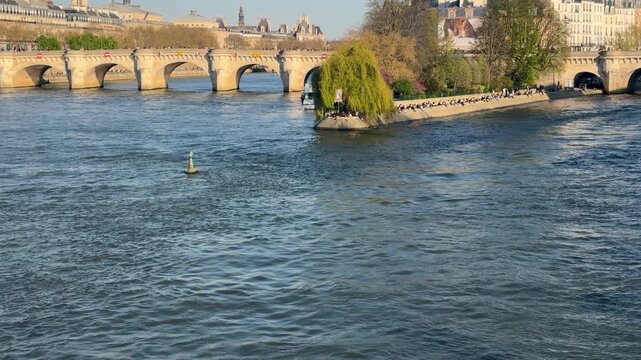 Picturesque view of river with historic structures and calm waters