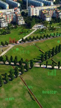 Vertical video: Drone descending, panning city park revealing turf while HUD sliding to show data