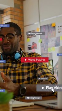 Vertical video: Cursor clicking play icon, man using PC animating UI badges on screen while sharing