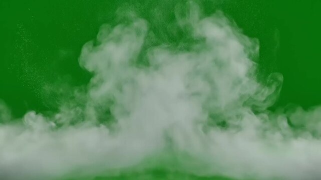 Emerald smoke clouds billow across a vivid green studio background in a cinematic abstract 4K loop