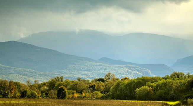 This landscape of rolling hills bathed in sunlight is the foothills of the Caucasus
