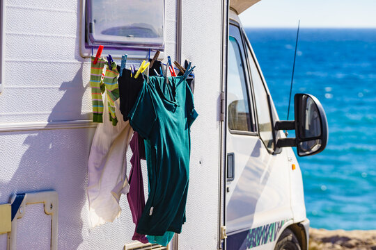 Clothes hanging to dry outdoors at caravan camp on sea shore