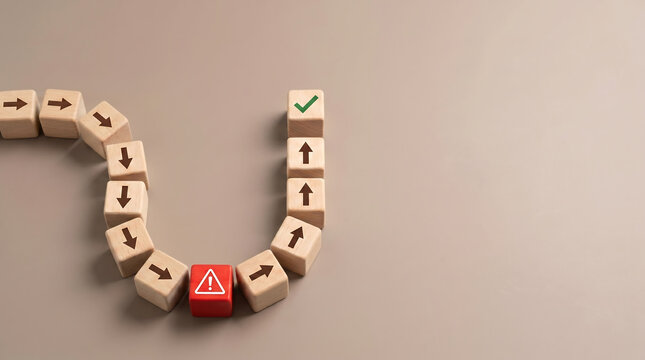 Business strategy path with wooden blocks showing u-turn direction change from red warning alert to green checkmark success goal on neutral background for risk management