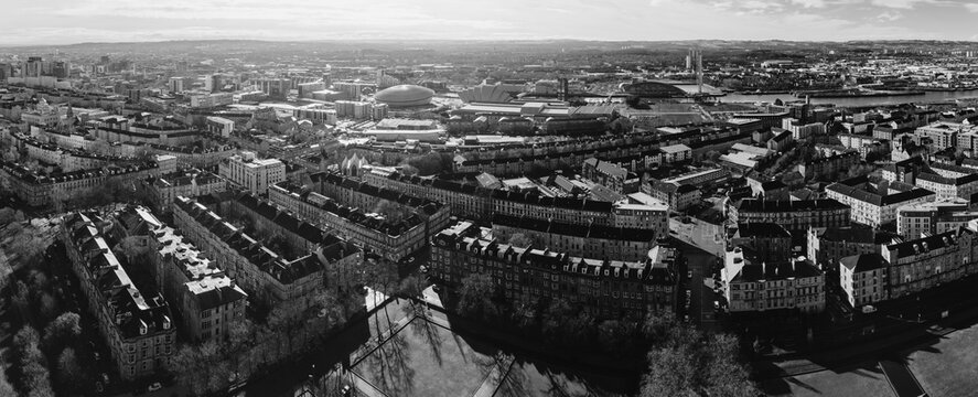 Glasgow Scotland: 13th Feb 2026: Drone panorama of Glasgow cityscape from high vantage point during daytime showing buildings, River Clyde, Hydro, Armadillo in monochrome