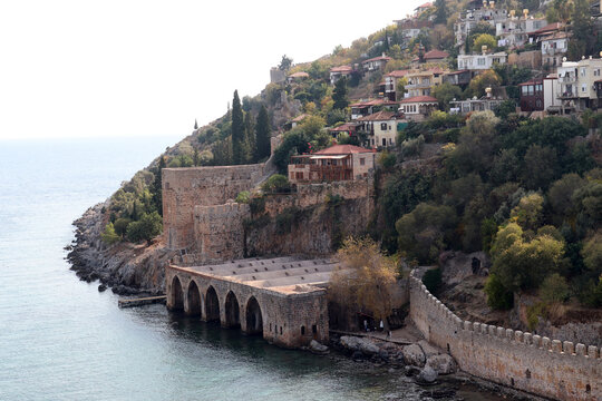 View from the sea to the ancient shipyard and the old town. Alanya, Turkey.