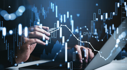 Obraz premium Hands analyzing digital stock market graph interface with glowing forex chart signals and investment data overlay on screen background.