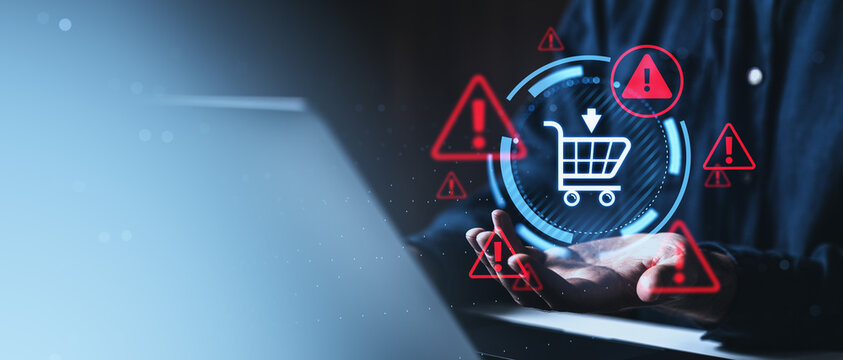 Digital shopping security warning concept with hands holding holographic cart and alert icons over dark interface technology sphere illustration background.