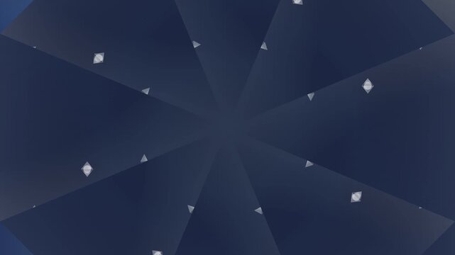 Snowflakes gently fall on a dark blue geometric patterned umbrella outdoors at night.